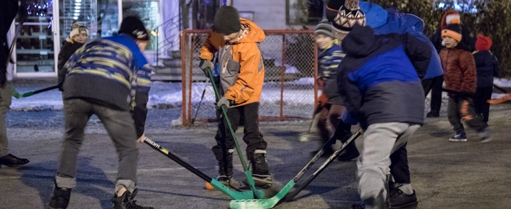 Kids play road hockey during the Snowflake Festival