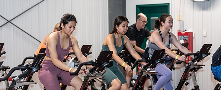 spin class participants on bikes