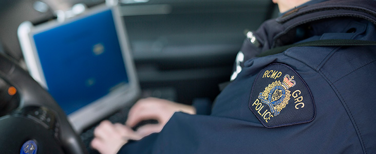 RCMP Officer using a computer