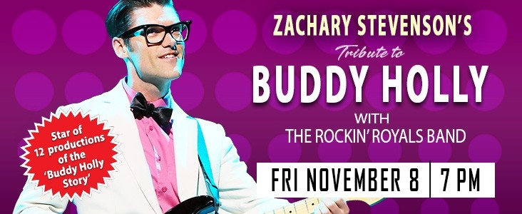 Zachary Stevenson poses as Buddy Holly in a white suite and pink shirt, against a polka dotted background