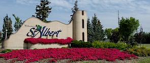 City of St. Albert entrance sign with pink flowers