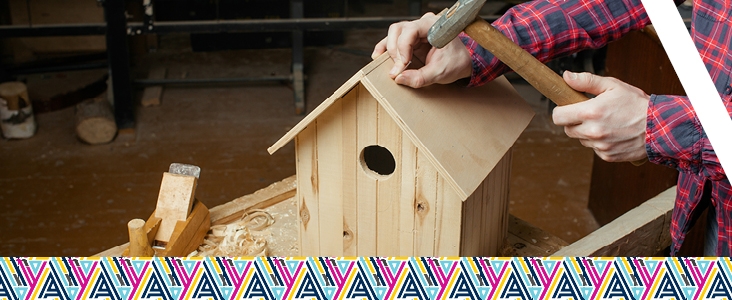 Image of a person using tools on a piece of wood.