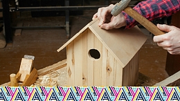Image of a person using tools on a piece of wood.