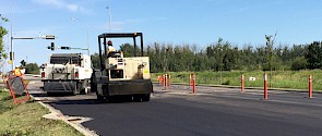 A City crew paves an arterial road